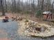 Backyard with pond and firepit at 15 Winterville Dr, Rockmart, GA 30153