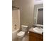 This is a bathroom with a bathtub, toilet, and sink with a granite countertop at 15 Winterville Dr, Rockmart, GA 30153