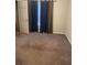 Bedroom with carpet, a window with blue curtains, and a door to the rest of the house at 15 Winterville Dr, Rockmart, GA 30153