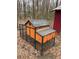 Backyard featuring a 'Rock City' chicken coop with orange siding at 15 Winterville Dr, Rockmart, GA 30153