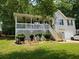 Charming two-story home featuring a covered porch, landscaped yard, and a fresh coat of exterior paint at 15 Winterville Dr, Rockmart, GA 30153