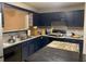 Functional kitchen with painted cabinets, modern appliances, ample counter space, and a decorative tile backsplash at 15 Winterville Dr, Rockmart, GA 30153