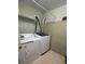 Functional laundry room equipped with a washer, dryer, and overhead shelving at 15 Winterville Dr, Rockmart, GA 30153