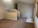 Cozy living room with plush carpet, a staircase, natural light from the front door and window at 15 Winterville Dr, Rockmart, GA 30153