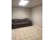 This living room features a grey sofa and tiled floor at 15 Winterville Dr, Rockmart, GA 30153