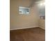 Neutral-toned living room with a ceiling fan, soft carpet, and plenty of natural light from windows at 15 Winterville Dr, Rockmart, GA 30153