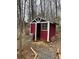 View of the red shed with a window and a metal trash can outside at 15 Winterville Dr, Rockmart, GA 30153