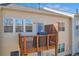 View of the back deck with railing, overlooking the yard and exterior of the home at 2735 Kimblewick Ct, Cumming, GA 30040