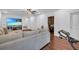 Spacious basement offers a comfortable seating area, television, and access to storage space at 2735 Kimblewick Ct, Cumming, GA 30040