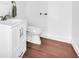 Bathroom showcasing single sink vanity, toilet and wood floors at 2735 Kimblewick Ct, Cumming, GA 30040