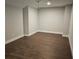 Bright room features wood floors, recessed lighting, and neutral color scheme at 2735 Kimblewick Ct, Cumming, GA 30040