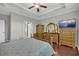 Comfortable bedroom with wooden furniture and ensuite bathroom access at 2735 Kimblewick Ct, Cumming, GA 30040