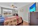 Bedroom showcasing ceiling fan, wood floors, chest of drawers, window and soft, neutral colors at 2735 Kimblewick Ct, Cumming, GA 30040