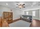 Upstairs bonus room featuring a cozy couch and decorative bookshelf at 2735 Kimblewick Ct, Cumming, GA 30040