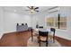 Bright dining area showcasing a round table with seating for four, natural light and wood-look floors at 2735 Kimblewick Ct, Cumming, GA 30040