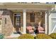 Inviting front porch with seating, perfect for enjoying the outdoors at 2735 Kimblewick Ct, Cumming, GA 30040