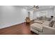 Living Room showing wood floors, sectional sofa, recliner and view to dining area at 2735 Kimblewick Ct, Cumming, GA 30040