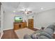 Cozy living room with hardwood floors, modern furniture, and ample lighting at 2735 Kimblewick Ct, Cumming, GA 30040