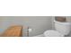 Clean toilet and toilet paper stand with bamboo basket beside at 2735 Kimblewick Ct, Cumming, GA 30040