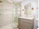 Bathroom featuring glass enclosed shower, vanity with sink, and gold hardware at 291 Lamplighter Se Ln, Marietta, GA 30067