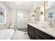 Modern bathroom featuring double vanity, freestanding tub, and glass shower at 291 Lamplighter Se Ln, Marietta, GA 30067