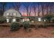 Charming house exterior showcasing manicured landscaping, blue shutters, and a cozy front porch at 291 Lamplighter Se Ln, Marietta, GA 30067