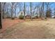 Spacious front yard with mature landscaping and trees, creating a welcoming approach at 291 Lamplighter Se Ln, Marietta, GA 30067