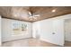 Bright main bedroom with wood ceiling, fan, and view to back yard and ensuite bath at 291 Lamplighter Se Ln, Marietta, GA 30067