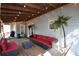 This spacious back porch has gray siding, a swing, seating, and string lights for relaxation at 671 Benson Hurst Sw Dr, Mableton, GA 30126