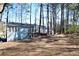 Expansive backyard with mature trees offering privacy and natural beauty, perfect for outdoor activities at 671 Benson Hurst Sw Dr, Mableton, GA 30126