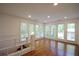 Well-lit bonus room with hardwood floors and large windows at 671 Benson Hurst Sw Dr, Mableton, GA 30126