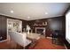 Cozy dining room features a fireplace, wooden table, and tile flooring at 671 Benson Hurst Sw Dr, Mableton, GA 30126