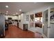 Modern kitchen featuring white cabinets and stainless steel appliances with access to a covered porch through sliding glass doors at 671 Benson Hurst Sw Dr, Mableton, GA 30126