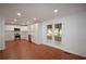 Bright kitchen with tile floors, stainless steel appliances, white cabinets, and a garden view at 671 Benson Hurst Sw Dr, Mableton, GA 30126
