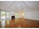 Spacious living room with hardwood floors, fireplace, and natural light at 671 Benson Hurst Sw Dr, Mableton, GA 30126
