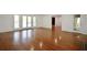 Bright living room with hardwood floors, fireplace, and French doors leading to the exterior at 671 Benson Hurst Sw Dr, Mableton, GA 30126