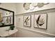 Stylish powder room with modern art and a decorative sink at 671 Benson Hurst Sw Dr, Mableton, GA 30126