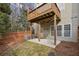 View of the backyard with a concrete patio, wooden fence, and the home's exterior at 1016 Parkmont Way, Decatur, GA 30033