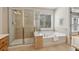 Bathroom boasts tiled shower and separate soaking tub at 1016 Parkmont Way, Decatur, GA 30033