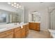 Spacious bathroom with dual vanities, large mirrors, and a glass-enclosed shower for a spa-like experience at 1016 Parkmont Way, Decatur, GA 30033