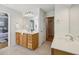 Bathroom featuring double sinks with white countertops and a view of walk-in closet at 1016 Parkmont Way, Decatur, GA 30033