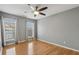 Bedroom offers hardwood floors, ceiling fan and natural light at 1016 Parkmont Way, Decatur, GA 30033