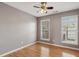 Bedroom offers hardwood floors, ceiling fan and natural light at 1016 Parkmont Way, Decatur, GA 30033