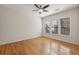 A well-lit bedroom featuring hardwood floors and three windows offering ample natural light at 1016 Parkmont Way, Decatur, GA 30033