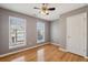 Bedroom offers hardwood floors, ceiling fan and natural light at 1016 Parkmont Way, Decatur, GA 30033