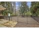 A fenced dog park with gravel, benches, and mature trees at 1016 Parkmont Way, Decatur, GA 30033