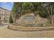 Stone community entrance sign with decorative flowers, 'Overlook at Clairmont' at 1016 Parkmont Way, Decatur, GA 30033