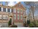 Charming brick townhome featuring a well-manicured front yard and an attached two-car garage at 1016 Parkmont Way, Decatur, GA 30033