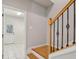 An oak wood staircase with decorative iron railings and a view of a tiled entry at 1016 Parkmont Way, Decatur, GA 30033