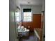 A cozy vintage bathroom includes blue and peach tiling, and a window for natural light at 1624 Beatie Ave, Atlanta, GA 30310